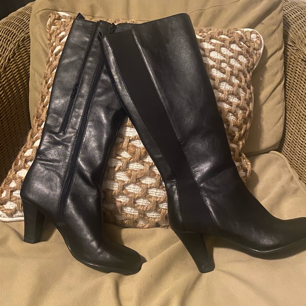 Heeled boots. Vegan leather. Lightly worn. Side zippers to make boots wider.